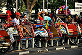 Riding the becak, the local cycle rickshaws in Malioboro street Yogyakarta. 